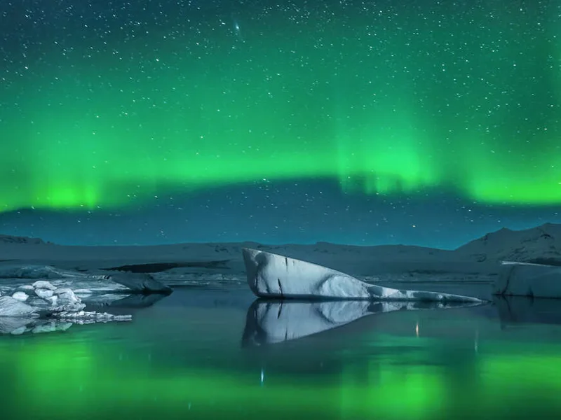 Northern lights over icebergs
