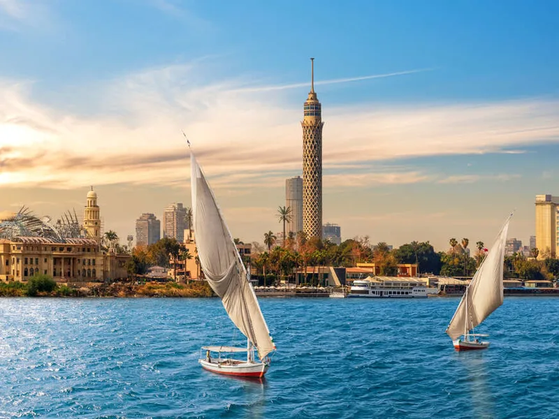 The Nile and feluccas in front of the Tower of Cairo